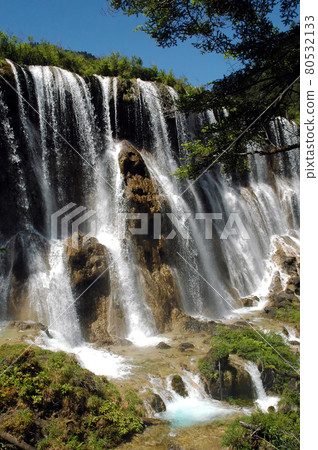 Juizhaigou (Nine Villages Valley) in Sichuan, China. View of Nuorilang Waterfall. Juizhaigou is a popular tourist destination in China famous for its waterfalls, lakes and scenic beauty. 80532133