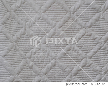 white soft cotton summer abstract patchwork pattern blanket hanging after wash in laundry. 80532184