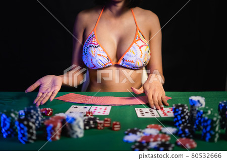 sexy women wearing bikini playing poker at the casino 80532666