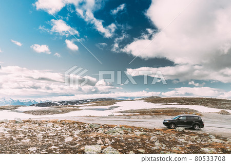 Aurlandsfjellet, Norway. Car SUV Parked Near Aurlandsfjellet Scenic Route Road In Summer Norwegian Landscape. Natural Norwegian Landmark And Popular Destination 80533708