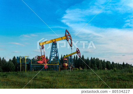oil pumping stations in a clearing in the forest oil pumping stations in a clearing in the forest 80534227