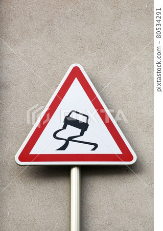 Slippery when wet road sign Slippery when wet road sign 80534291