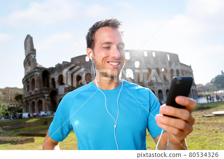Happy Jogger Listening Music Against Colosseum 80534326