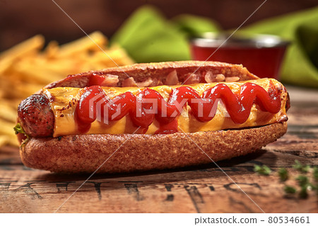 Hot dog in whole grain hoagie roll with sausage, cheese, tomato sauce Hot dog in whole grain hoagie roll with sausage, cheese, tomato sauce 80534661