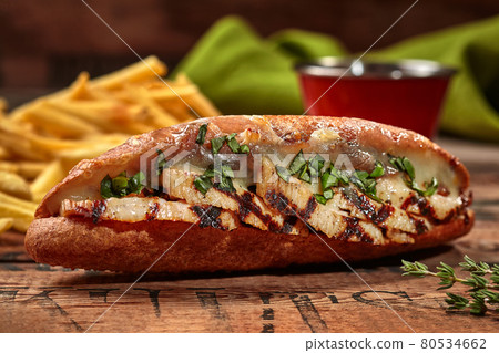 Submarine sandwich from split hoagie roll with pork and cheese Submarine sandwich from split hoagie roll with pork and cheese 80534662