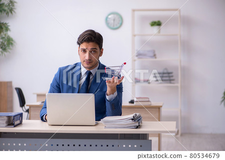 Young male employee sitting in the office 80534679