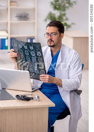 Young male doctor radiologist working in the clinic 80534886