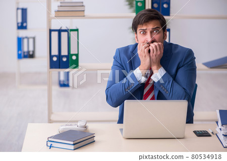 Young male employee working in the office Young male employee working in the office 80534918