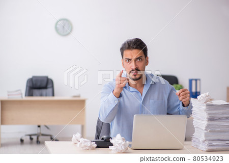 Young male employee rejecting new ideas in the office Young male employee rejecting new ideas in the office 80534923