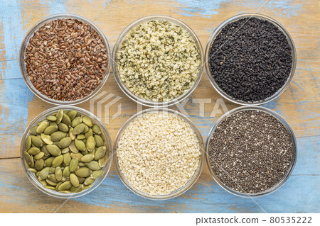 healthy seed collection in glass bowls healthy seed collection in glass bowls 80535222