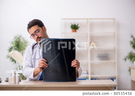 Young male doctor radiologist working in the clinic Young male doctor radiologist working in the clinic 80535438