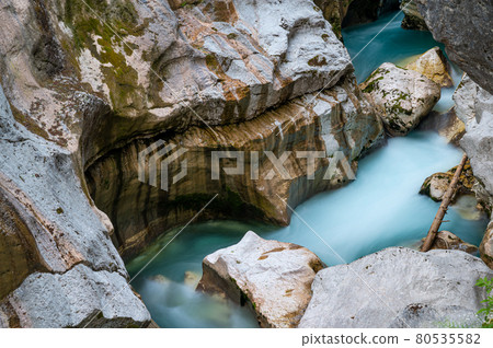 Blurred image of beautiful turquoise river soca 80535582
