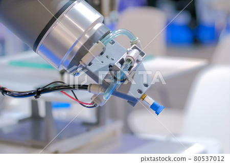 Automated robotic arm during work at modern robot exhibition - close up view Automated robotic arm during work at modern robot exhibition - close up view 80537012