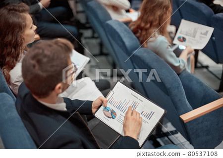 young business people listening to a lecture on business development . 80537108