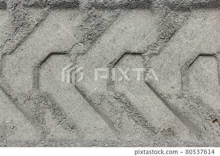 Tire track on muddy road 80537614