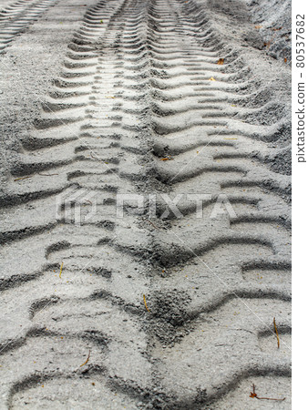 Tire track on muddy road 80537682