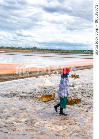 Phetchaburi Salt flats Naklua, farms and farmers collecting salt in Phetchaburi, Thailand 80538672