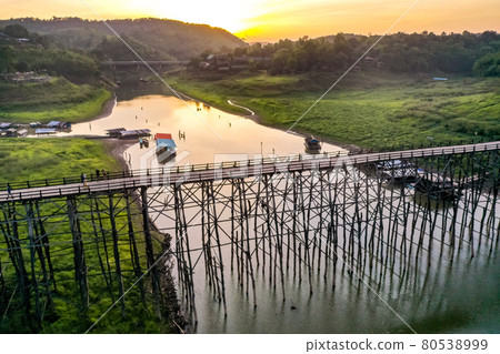 Mon Bridge, old wooden bridge at sunset in Sangkhlaburi, Kanchanaburi, Thailand Mon Bridge, old wooden bridge at sunset in Sangkhlaburi, Kanchanaburi, Thailand 80538999
