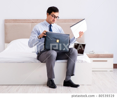 Businessman working in hotel room Businessman working in hotel room 80539319