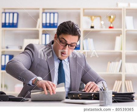 Businessman in industrial espionage concept 80539365