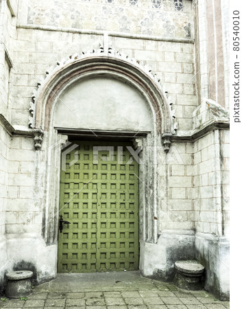Vintage side entrance in Church of St James the Apostle in Torun, Poland Vintage side entrance in Church of St James the Apostle in Torun, Poland 80540010