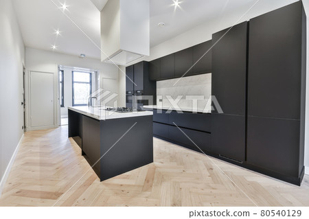 Interior of a beautiful kitchen of an elite house Interior of a beautiful kitchen of an elite house 80540129