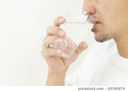 Men drinking water Men drinking water 80540874