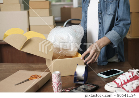 Online business owner preparing product to customer. 80541154