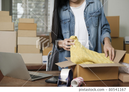 Online business owner preparing product to customer. 80541167