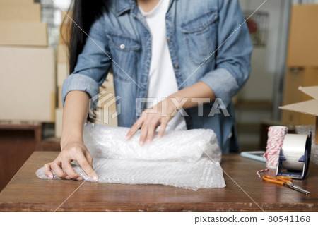 Online business owner preparing product to customer. 80541168