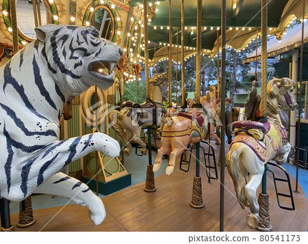 Holidays to play with kids in merry-go-round 80541173