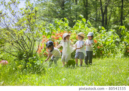 Children and nursery teachers enjoying outdoor play Children and nursery teachers enjoying outdoor play 80541535