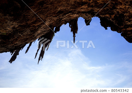 Reef Rock Beach Under the Large Cave of Phra Nang Cave in Krabi Province, Thailand ,This is a sunset time at Ao Tham Phra Nang Beach. Reef Rock Beach Under the Large Cave of Phra Nang Cave in Krabi Province, Thailand ,This is a sunset time at Ao Tham Phra Nang Beach. 80543342
