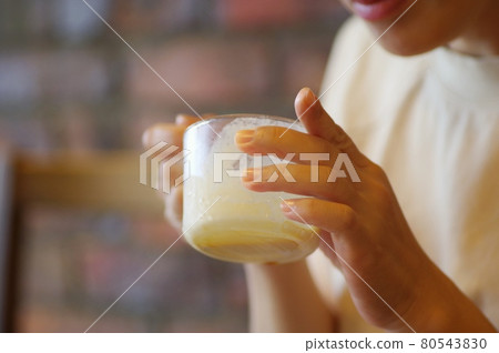 Woman eating ice cream dessert 80543830