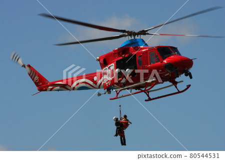 Okayama Prefecture's fire and disaster prevention helicopter "Kibi" demonstrating lifting rescue at an event 80544531