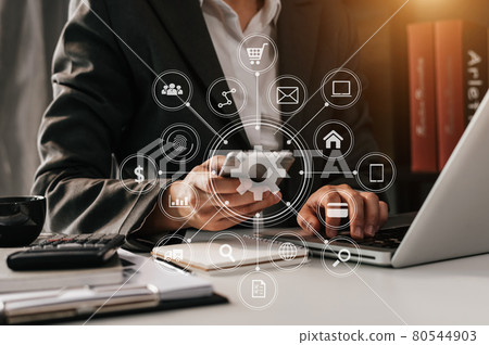 .business woman hand working with laptop computer, tablet and smart phone in office with digital marketing media .business woman hand working with laptop computer, tablet and smart phone in office with digital marketing media 80544903