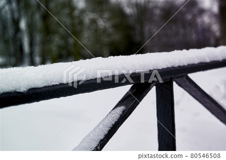 Abstract photo of iron struts covered with soft fresh snow Abstract photo of iron struts covered with soft fresh snow 80546508