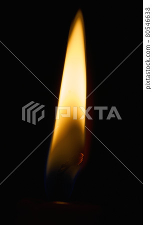 Close up of yellow candle flame on the black glowing wick of dark red candle Close up of yellow candle flame on the black glowing wick of dark red candle 80546638