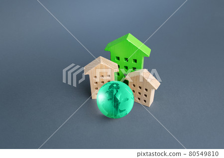 Residential buildings and green globe. Energy efficiency, zero carbon emissions. Environmentally friendly housing, minimal impact on environment. Carbon neutrality. Internet service communication. IoT Residential buildings and green globe. Energy efficiency, zero carbon emissions. Environmentally friendly housing, minimal impact on environment. Carbon neutrality. Internet service communication. IoT 80549810