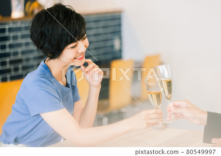 A woman toasting A woman toasting 80549997