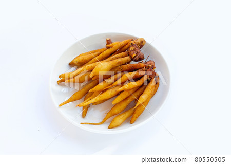 Finger root in white plate on white background. Finger root in white plate on white background. 80550505