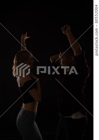 man and woman dancing to music in the dark man and woman dancing to music in the dark 80552004