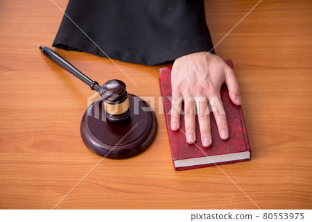 Young male judge working in the courtroom 80553975