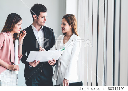 Businessman and businesswomen working in office. Businessman and businesswomen working in office. 80554191