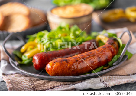 Grilled spicy sausages Grilled spicy sausages 80554345