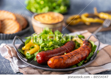 Grilled spicy sausages Grilled spicy sausages 80554347
