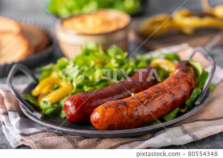 Grilled spicy sausages 80554348