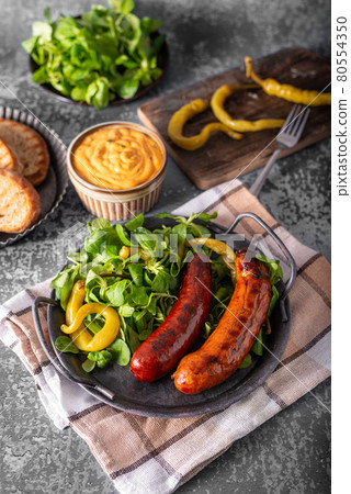 Grilled spicy sausages Grilled spicy sausages 80554350