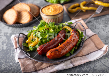 Grilled spicy sausages Grilled spicy sausages 80554352