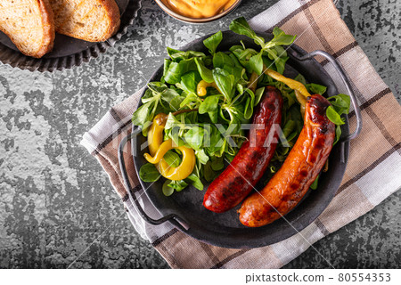 Grilled spicy sausages Grilled spicy sausages 80554353